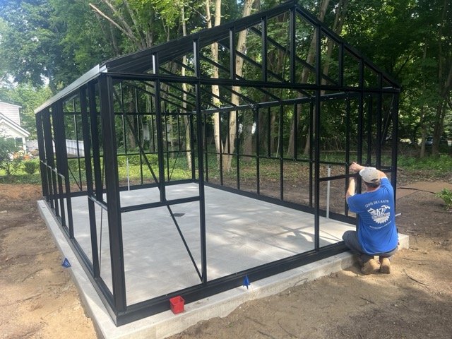 Assembling the greenhouse frame